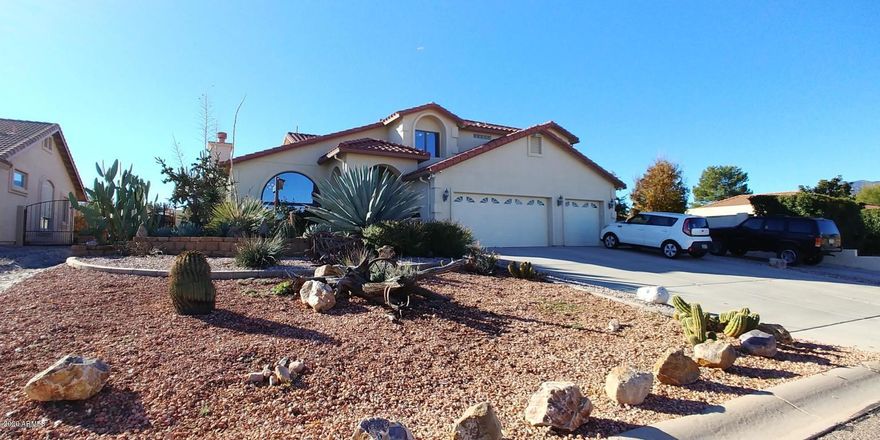 This property is beautiful and ready for new owners.  There is a formal living room with fireplace and dining room with cathedral ceilings.  There is also a family room with a fireplace you will love this winter.  There is a wonderful kitchen with tons of counter space and stainless appliances.  There is an office with oak builtins downstairs.  Upstaris there are 4 bedrooms that have fresh paint, expanded closets and new ceramic tile.  The master bedroom has huge closets and a highly upgraded bath with walk in shower, dual sinks and ample counter space.  There is a private deck to enjoy the beautiful view of the Huachuca Mountains and relax.  There is also a 3rd level deck.  Amazing pebble tec pool and a fully functional guest house.