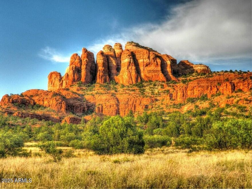 One of the best and most viewtiful lots in CR Ranch. Cathedral Rock and Seven Warriors Mesa red rock mountain range are unobstructed. This is a big 1 acre lot and owner has already done ALL the preliminary work.  Perc test, topo survey, tree survey and soils expansion test are done, see them in Documents.  House plans that Seller had designed are included. Lot is mostly level for easy build. Your are just 10 minutes from shopping, medical services and golf in VOC and 25 minutes to Sedona.  Here you have peace, quiet and dark night sky you didn't know existed.