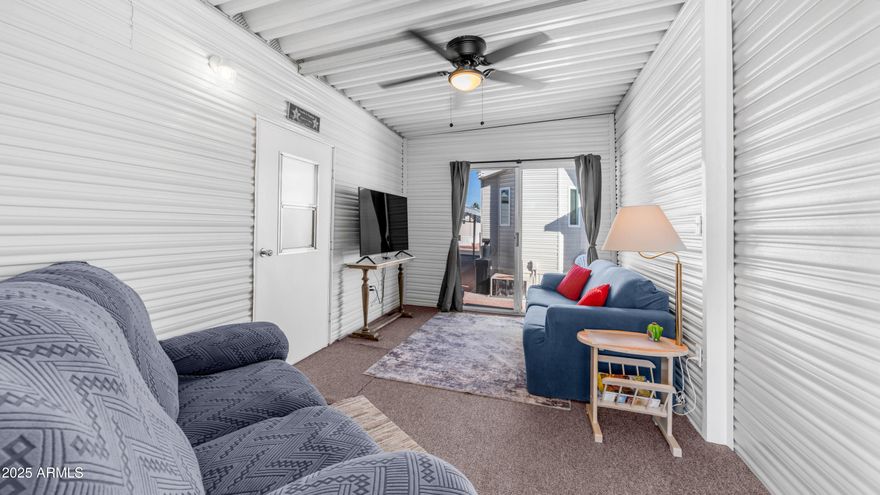 Step right into this Golden Vista charmer where the fun begins before you even reach the front door thanks to a spacious outdoor deck with brand new carpet & railing that practically begs you to sit down, sip something delicious & brag to your friends about the weather. The entire exterior was freshly painted, the new shingled roof is ready to impress & the storage game is strong with pull out drawers under the home including two shiny new ones that are ready for all the things you swear you will organize someday. Head inside to vaulted ceilings with zero popcorn in sight, new ceiling fans, new light fixtures & wood look laminate flooring throughout that makes the whole place feel extra polished without requiring you to become a professional floor cleaner. The kitchen is wonderfully open with a full sized ceramic top stainless steel stove, updated painted cabinets with new hardware & plenty of cabinet space for snacks, gadgets or those random souvenir cups you refuse to let go of. Enjoy the perks of a new forty gallon water heater, water softener & brand new plumbing throughout which means fewer surprises & more relaxing. The casita is the perfect little getaway for guests complete with a cozy bed, half bath & stacked washer & dryer so company can do their own laundry which honestly should be a requirement everywhere. Thanks to the newly added fifth wall & new back door you can live indoors or outdoors in just about any weather which is exactly why this place feels like the crowned jewel of resort living. Add in Golden Vista's amazing amenities, endless activities, friendly neighbors & true resort style atmosphere & you just might find yourself wondering how you ever lived without your own outdoor living room.