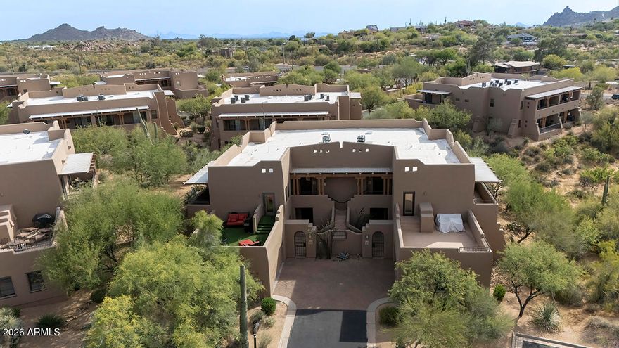 36601 N Mule Train Road #A41, Carefree, AZ 85377 is a beautifully remodeled 2-bedroom, 3-bathroom single-level residence with 1,970 square feet, wood flooring, quartz countertops, remodeled kitchen and baths, desert and mountain views, and a quiet first-floor location in the gated Village at Carefree community. Located in the heart of Carefree, Arizona, near CIVANA Resort and Spa, downtown Carefree, Cave Creek, hiking, golf, dining, shopping, and scenic Sonoran Desert surroundings, this home is ideal for full-time living, seasonal living, or a low-maintenance Arizona retreat.

This light and bright first-floor unit offers a thoughtfully updated interior with no interior steps, a spacious open living area, and a flexible floor plan designed for comfort, privacy, and easy desert living. Th great room features wood flooring, a charming corner fireplace, and a sliding glass door leading to the covered outdoor patio, creating a warm and inviting space to relax or entertain.

The remodeled kitchen has been opened up to improve flow and functionality, with a small wall removed to create a more spacious feel. Beautiful quartz countertops, a sit-up breakfast bar with stone accents, new cabinetry, added wall storage, built-in microwave, dishwasher, disposal, electric range, electric oven, electric cooktop, and refrigerator make this kitchen both stylish and practical.

The primary suite is generously sized and offers a peaceful retreat with a sitting area, his and her closets, dual vanities, a sleek remodeled walk-in shower with frameless glass enclosure, and a separate water closet. The split bedroom layout provides privacy for guests, family, or part-time visitors.

The second bedroom lives like its own private guest suite, featuring a separate den or office area, kitchenette with full-size refrigerator, remodeled bathroom with frameless walk-in shower, and access to a lovely patio where you can enjoy the Arizona lifestyle. With three full bathrooms, this home offers excellent flexibility for visitors, working from home, or extended stays.

Set next to a natural open space area, this building offers a quiet and private setting with beautiful desert and mountain views. The covered patios, wrought iron fencing, desert landscaping, and peaceful surroundings create a true Carefree retreat.

Additional features include double pane windows, central air, ceiling fans, programmable thermostat, inside laundry with washer and dryer, high-speed internet, fire sprinkler system, attached garage with cabinets, two carport spaces, shared driveway, and convenient first-floor access.

The Village at Carefree is a desirable gated community known for its tranquil desert setting, resort-style amenities, and easy lock-and-leave lifestyle. Residents enjoy a large community pool, heated community spa, biking and walking paths, and a newly remodeled clubhouse used for neighborhood gatherings and community events. The HOA also includes roof repair, roof replacement, exterior maintenance, front yard maintenance, street maintenance, trash, and common area maintenance, adding convenience and peace of mind.

Across the street is the newly renovated CIVANA Resort and Spa, a well-known wellness destination that adds to the appeal of this exceptional Carefree location. With nearby access to Carefree and Cave Creek restaurants, boutique shopping, art galleries, golf courses, hiking trails, and outdoor recreation, 36601 N Mule Train Road #A41 offers the perfect blend of comfort, privacy, convenience, and Arizona desert lifestyle.

Whether you are searching for a remodeled Carefree home, a gated community residence, a seasonal Arizona getaway, or a low-maintenance lock-and-leave property near CIVANA Resort and Spa, this beautifully updated Village at Carefree home is a must-see.