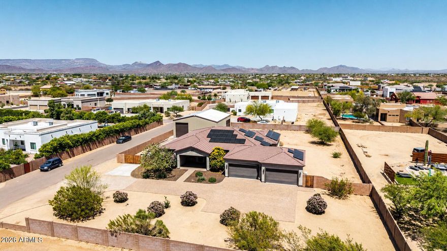 Professional-grade custom workshop, RV garage, and an expansive lot make this exceptional property a rare find in today's market. Thoughtfully designed with space, functionality, and versatility in mind, this home offers the perfect blend of comfort and convenience in one of Phoenix's most sought-after locations.

Inside, you'll find a highly desirable floor plan featuring three spacious bedrooms, each with its own private full bathroom, providing outstanding privacy and flexibility for family, guests, or multigenerational living. The open-concept design, quality finishes, and abundant natural light create a warm and inviting atmosphere throughout.

Surrounded by beautiful desert scenery, this property offers endless possibilities
