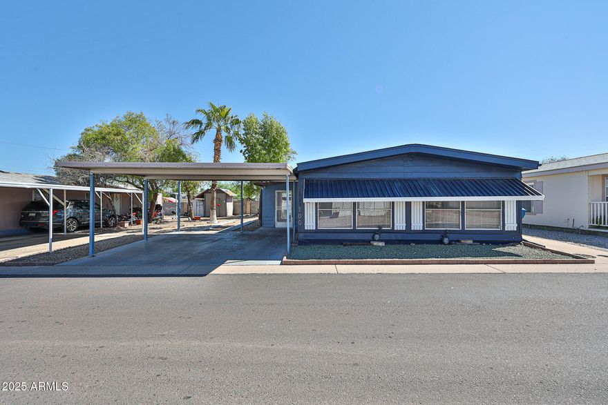 Family Friendly community! Double-wide Manufactured home. Freshly painted outside 2025. Ceiling fans with light installed 2023 in every room. Tyle floor though out the manufactured home installed 2022. Kitchen remodel 2022 with counter quartz, built in microwave, bathrooms remodel 2023, New blinds in windows, Arizona room tile and remodel 2021. Space to convert a 3rd bedroom. Space to park a 3rd car. This community is close to gyms, restaurants, shopping, and schools. It also offers a Large Rec Center with a community pool. It's a must-see!