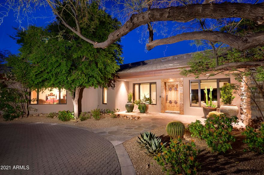 This artfully crafted 5,050 sq ft home with a 1,370 sq ft guest house sits on 2.5 acres and has a 3 car garage, pool, spa and waterfall with a flowing river.  It offers a master chefs kitchen with granite counter tops and butlers pantry.  Glass windows and doors from floor to ceiling which presents magnificent views of the famous Boulders resort and two golf courses and incredible city light views.  Guest house has a bedroom, living room, kitchen, fireplace and quartz floors.  The home has all the smart wiring plus powered draperies & blinds and pool side BBQ.  If you are looking for a home with all the features you would desire plus endless views, you have just found it and no more need to keep looking.