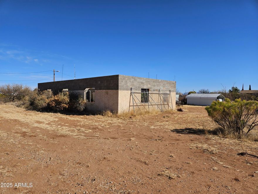 Corner Commercial Property 2.37 Acres with block shell building, & include 2 Mobile homes. 2 septic and a well. Owner may carry. At 10% with 25% down with a 5yr balloon.
