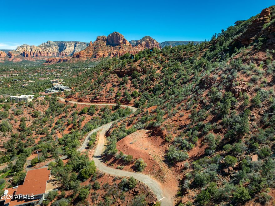 Commanding red rock views from this elevated building site with incredible 360 degree red rock views that's also overlooking the rushing waters of Oak Creek and its massive Sycamore and Cottonwood trees.  Unique/highly sought after location has secluded end of the road privacy, yet only a block to National Forest trails and a few minutes from West Sedona or the Village of Oak Creek. Build your dream house at your own pace - choose to build now or wait until you're ready to start construction in the coming months/years.  No time requirement to build. No HOA oversight means you'll only need to comply with city building code and there's no restriction on rentals. Possible Seller financing available.