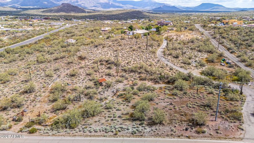 Experience the beauty of the Sonoran Desert with the convenience of easy access from this 2.7-acre New River homesite! The property already features an established driveway, capped well, and power at the lot--making it an ideal setting to build your dream home. Enjoy sweeping 180+ degree views of the surrounding mountain ranges, including the iconic Gavilan Peak. A natural arroyo and wildlife corridor along the property creates a scenic buffer from 27th Avenue while enhancing the peaceful desert setting. Only 5 minutes from I-17 and all on asphalt.