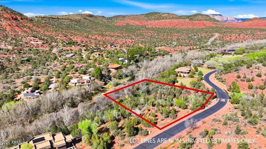200 feet of Oak Creek frontage. 2.27 acres. Red rock views. In the exclusive gated subdivision of Cross Creek Ranch.... How could you be looking for anything else?

This combination rarely comes up for sale in Sedona, and anyone who's spent time here knows it. The property sits quietly off the main corridor, where underground utilities keep the landscape exactly as nature intended and the only sounds competing with the creek are the birds. Hiking trails are steps away, yet Sedona's restaurants and galleries are less than 15 minutes down the road, with multiple wineries in Cornville equally close in the other direction. 

The lot itself gives a future home almost endless placement options. There's room to set a structure back from the bank, orient toward the views... (see more) (continued)...and still have the creek as your backyard soundtrack. Crossing the 300' long community entrance bridge transcends you to a place of tranquility and remoteness. Whether you're thinking a primary residence or a family estate, the bones of this property do most of the work for you.

See attached for proposed floor plan and site plan.