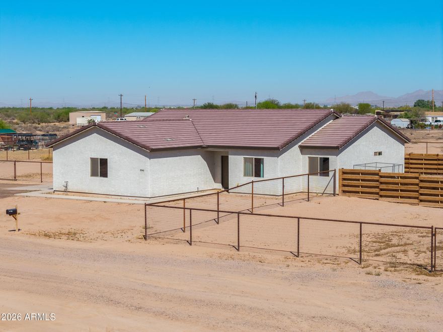 Built in 2023, this rare 4-bedroom, 2-bath horse property sits on 1.4 acres and offers space, style, and functionality. Features include an oversized garage, pipe fencing around the entire property, and a covered patio. Inside, enjoy tile flooring, expansive vaulted ceilings, and an open-concept floor plan. Quality 2x6 construction with spray foam insulation adds efficiency. The kitchen boasts quartz countertops, upgraded cabinetry, a large island, and stainless steel appliances. The guest bath offers a dual vanity and shower/tub combo. The spacious primary suite includes an extended vanity and updated walk-in shower. An oversized laundry room completes this exceptional home.