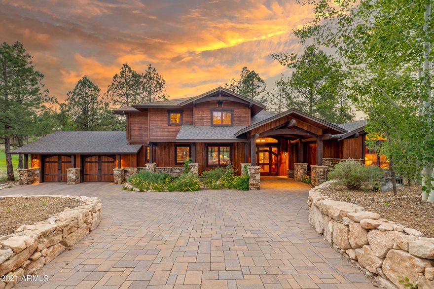 Perfection in the Pines.  The very best homesite within the private golf community of Pine Canyon, Flagstaff.  The home was built by Builder Showcase, the most prestigious builder in Northern Arizona.
Professional designed lush landscape surrounds the homesite in the quiet cul-de-sac with paver driveway and three-car garage and additional space for exterior parking.  The entry features a glass door that leads you into a heavenly view of the water, golf, and endless tall pines!  
On the main level, you have an entertainer's dream of soaring ceilings, endless glass, and cozy great room with floor to ceiling gas fireplace!  The main level features a guest en suite, media room, and a half bath.
The gourmet kitchen encompasses stainless steel appliances, wolf-subzero, breakfast bar, and dini room all perched over the lake and panoramic golf!  The patios are extremely private, provide an electronic screen, built-in bbq, heaters, and exterior television. 
Upstairs you have two oversized bedrooms, bathroom, loft, and balcony capturing timeless serenity! Truly a rare opportunity to capture the most coveted location in Pine Canyon.  Walking distance to the clubhouse, walking distance to park, national forest trail system!  There is not higher quality, location, and home than 2610 Bueno Vista.