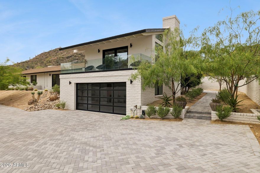 Beautifully updated and remodeled in 2024, this inviting Cave Creek home offers a rare blend of comfort, flexibility, and serene desert living just moments from Cave Creek Regional Park. With mountain views, wide-open skies, and a peaceful sense of privacy, the property is designed for easy, low-maintenance living with the added benefit of lock-and-leave convenience. The main residence features 2 bedrooms and 2 baths, while the attached guest quarters provide a welcoming retreat with 2 additional bedrooms, 1 bath, a full kitchen, and a family room--ideal for extended guests, multigenerational living, or extra space to relax. Thoughtful upgrades throughout include quartz countertops, Wolf and Bosch appliances, Milgard windows and doors, updated flooring, fresh interior paint, custom pavers, and an electronic driveway gate. With no HOA, room for RV parking, low real estate taxes, abundant wildlife, and a move-in ready interior, this is a special opportunity to enjoy the beauty and ease of Cave Creek living.