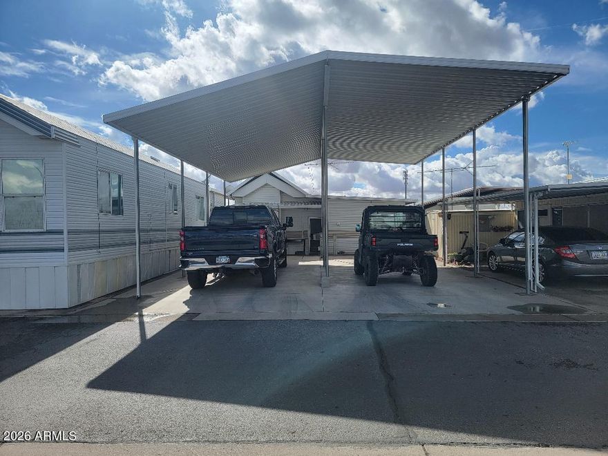 This is a fully covered lot with all hook ups and a shed, This would be much easier to access a motor home into because it is off of Maricopa (an exterior street) and more room to back up. The home directly behind this lot at 220 Mesquite is also available for sale for a total of $130,000 if you would like to purchase both, otherwise the lot is available by itself.