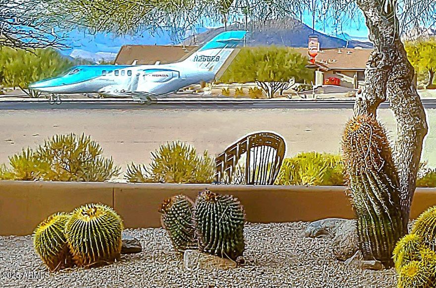 Lowest price at Skyranch in a Quiet location not on the road. THE ONLY AVAILABLE SKYRANCH TOWNHOME  on the runway with runway and mouontain views,  near the pool/spa facilities. Brand new $11500 Carrier HVAC system just installed! Kitchen wall has been removed to open up the area  with views to the Great Room and patio.  Wonderful vistas to the North of Continental Peak. Gated Skyranch is a private airport with  less than  4 operations a day.  Enter thru custom rusted iron gates. Close to the award-winning town center, cactus garden, shops & restaurants.  Residents have  lightly-used this well-maintained home. The  2-car garage has professionally-done epoxy flooring, and nice upgrade of quartz counters in the kitchen Exterior was repainted 2023, See the video tour