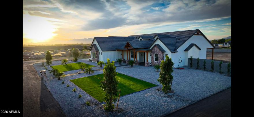 Welcome home to this beautiful brand new build Modern Farmhouse! This property sits on a corner acre lot with spectacular mountain views! Step into an impressive open floor plan that boasts Modern Farmhouse living with a spacious great room w/ vaulted beamed ceilings, tile flooring throughout, modern linear a/c vents, recessed lighting, RV gate, 3 car side garages that provide an EV charging outlet and a mini-split a/c unit. Lavish bathrooms designed with high end aesthetic fixtures, owners suite also features vaulted beamed ceiling, double vanity and a dreamy walk in closest. The gorgeous open concept upgraded Kitchen features a large island, quartz countertops, high end appliances and ample cabinet and counter space. Country living couldn't get any better and this beauty won't last long!