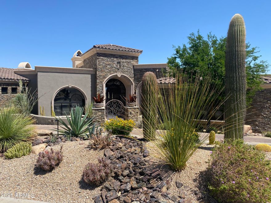 Unbelievable breathtaking VIEWS of mountains sunset & boulder outcroppings showcase this like new home.  The split floor plan includes 4 bedrooms, including a swank Casita, office and a home theater - all on ONE LEVEL. The Viking kitchen boasts 2 dishwashers/dbl. ovens/warming drawer/48'' cook-top w/cantera hood, a 72'' fridge/freeze, custom pantry & wet bar surrounding an enormous 8x10' island.  Other features include floor to ceiling 10' high butt glass walls, auto telescoping door, arched windows, cantera fireplaces wet bar & 100-bottle wine closet, coffered/groined/hand painted & box beamed ceilings,  custom cabinetry, infinity pool & spa, 2100/sf covered patio.complete w/outdoor kitchen & fire pit & fire features, misters & upper view deck, gated courtyard entrance w/fountain, Not to be overlooked are the security system w/cameras, central vac, whole house speakers and 9-Seer 4-zone air conditioners. This home brings AZ living at its best and if VIEWS are on your clients wish list you have found it!