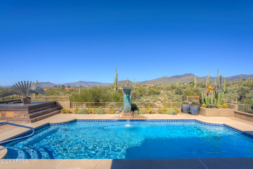 Located in the picturesque, rolling hills of Carefree is a treasure of a home extensively renovated in 2005 with views that are unparalleled.  Greeted by a charming paved front patio and whimsical, artistic gates, you enter through the foyer and are taken away by uninterrupted mountain views that are grand and sweeping.  Fabulous open floorplan lends itself to entertaining. Eat in chef's kitchen with oversized island and an abundance of custom cabinetry, walk in pantry.  Floorplan is thoughtful, with a primary suite that offers private den / office space.  Backyard is rich in specimen quality native desert plants and a refreshing pool.  Oversized patios offer opportunities to dine al fresco. Continued below Set just apart from the main home, an artist's casita offers a private, inspiring retreat. Bathed in natural light and surrounded by desert flora, it's ideal as a studio, guest space, or quiet sanctuary for creative work. Together, the home and casita create a peaceful compound, perfect for those seeking solitude, inspiration, and the timeless beauty of the desert landscape.