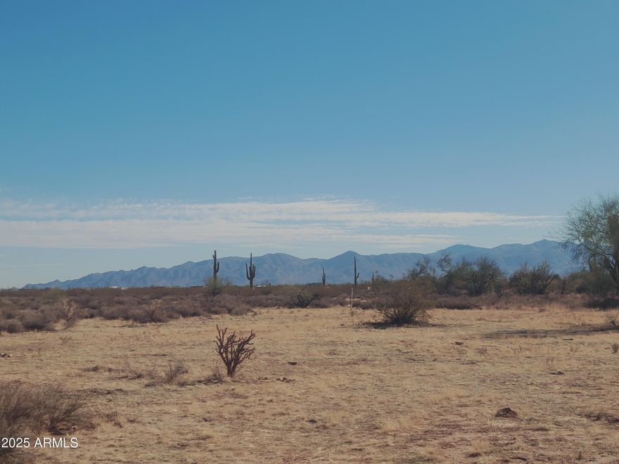 Scenic Acre Parcel in Growing Wittmann, AZ — Additional Lot Available!
Enjoy breathtaking mountain views in a rapidly developing area of Wittmann, Arizona. This 1-acre parcel offers a rare opportunity with an additional adjacent parcels also available—buy one or both!
•	No floodplain concerns
•	Shared well already drilled and capped
•	Power nearby (approx. 1/2 mile away)
Whether you're a small builder looking for the perfect project site or an investor seeking opportunity, this is a dream come true. The area is developing fastdon't miss your chance to own a slice of Arizona heaven. Surrounded by wide-open spaces and close to thousands of acres of public land, it's perfect for horses, toys, and outdoor adventure.
Come explore the possibilities today!