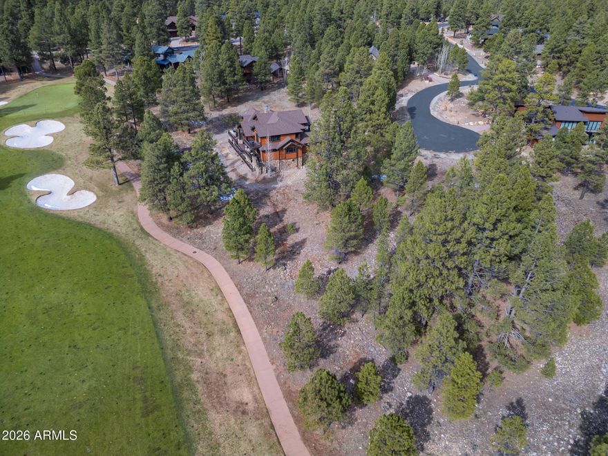 Nestled at the end of a quiet cul-de-sac, this breathtaking homesite offers the perfect blend of privacy, scenery, and premier golf course living. Overlooking the 12th fairway of the award-winning golf course, the property captures serene, sweeping views in a truly picturesque setting.
Gently sloped and beautifully treed, this over half-acre lot provides an ideal canvas for a custom home, with natural topography that enhances both design potential and surrounding sightlines. Whether you envision expansive outdoor living spaces or windows that frame the lush fairway views, this homesite delivers the setting to make it extraordinary.