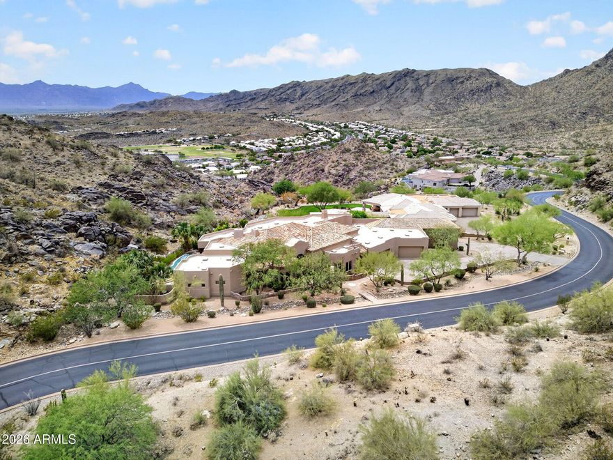 Perched on the mountainside with breathtaking 180-degree mountain views, this one-of-a-kind estate offers an unmatched setting on 1.61 acres PLUS an additional adjacent .74-acre parcel included in the sale. With 6,588 sq ft, this custom home was designed to maximize privacy, scale, and the incredible backdrop surrounding it. Features include a resort-style pool, basement, and an extraordinary 10-car garage for the ultimate collector or hobbyist. Opportunities like this are incredibly rare... a true legacy property with land, views, and amenities that simply cannot be replicated.