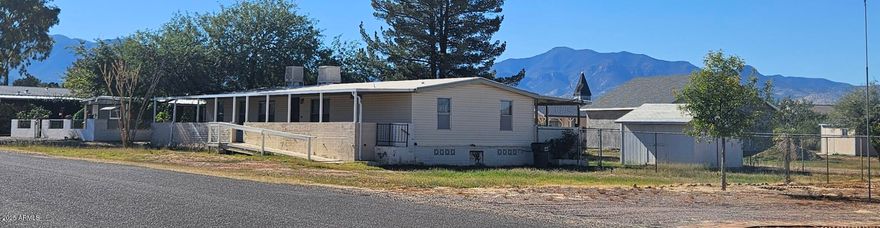 1,536 square foot, 3 bedroom, 2 bath home on a lot that is just under quarter of an acre. Entire back yard enclosed with chain link fencing. Large storage shed. Home offers a very large living room. formal dining room, kitchen with two sided breakfast bar. Laminate flooring through out except in kitchen and utility. The large utility room has additional storage and base cabinet with countertop. The front and back of home have full length covered patios. Front entrance offers a ramp for access. Home does need some work. Sold As Is.
