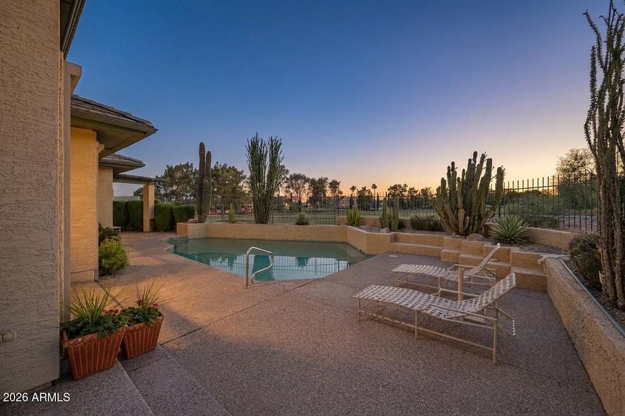 Rare golf course & stunning mountain view lot overlooking hole 1 of the Biltmore Links course while siding the canal; unquestionably the best lot in the community! Ideally positioned in the vibrant central corridor, the home is minutes from the iconic Biltmore Resort; home of legendary personalities, casual & fine dining, shopping & outdoor play/venues.  Thoughtfully designed with enduring style, the home showcases subtle art-deco influence, custom built-ins, soaring coffered ceilings, & rich crown and beam detailing.  A residence where architecture and location quietly outperform trends with timeless elegance.  Natural light fills the interior while this desirable enclave is perfect for a lock & leave lifestyle.  If you value location & views you won't want to miss this rare offering!