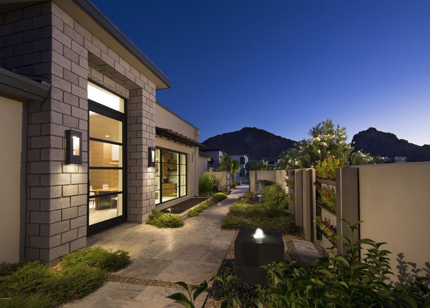 BRAND NEW CONSTRUCTION! NESTLED AT THE BASE OF THE VALLEY'S MOST ICONIC NATURAL LANDMARK, CAMELBACK MOUNTAIN, THE VILLAGE AT MOUNTAIN SHADOWS IS SITUATED IN THE HEART OF PARADISE VALLEY. THIS EXCLUSIVE GUARD GATED ''LOCK AND LEAVE'' RESORT STYLE COMMUNITY IS COMPRISED OF 40 RESIDENCES AND IS WITHIN WALKING DISTANCE OF TWO MAGNIFICENT HIKING TRAILS, LANDMARK RESTAURANTS AND RESORTS. TO BE BUILT BY CULLUM HOMES IS THIS CHOLLA CUSTOM FLOOR PLAN, WITH 3 BEDROOMS PLUS A DEN/OFFICE, 3.5 BATHROOMS AND 3-CAR GARAGE. 3667 SF OF SPACIOUS LIVING SPACE.  GREAT ROOM WITH BUILT-IN FIREPLACE AND POCKET DOORS LEADING OUT TO THE COVERED PATIO. FORMAL DINING AREA. SPACIOUS KITCHEN WITH WALK-IN PANTRY, EAT-AT BAR AND KITCHEN ISLAND.  ALL STAINLESS-STEEL APPLIANCES INCLUDING SUB-ZERO SIDE-BY-SIDE FRIDGE/FREEZ AND WOLF 8-BURNER GAS RANGE. FULL SIZE WET-BAR AREA WITH EAT-UP BAR SEATING, WINE ROOM, AND BUFFET WINDOW THAT OPENS TO THE PATIO AREA. OWNER'S SUITE WITH WALK-IN CLOSET, DUAL SINK VANITIES, SEPARATE SHOWER AND TUB. BOTH GUEST BEDROOMS HAVE EN-SUITE BATHS.  PRIVATE DEN/OFFICE JUST OFF THE ENTRANCE OF THE HOME. LAUNDRY ROOM AND AN ADDITIONAL POWDER BATH. COMMUNITY POOL AND SPA AND LARGE COMMUNITY PARK. IN ADDITION, ALL RESIDENTS RECEIVE ACCESS TO THE PLETHORA OF AMENITIES AVAILABLE AT THE MOUNTAIN SHADOWS RESORT. GUARD GATED 24/7 FOR PRIVACY AND SECURITY SO YOU CAN ENJOY THAT "LOCK-N-GO" LIFESTYLE!