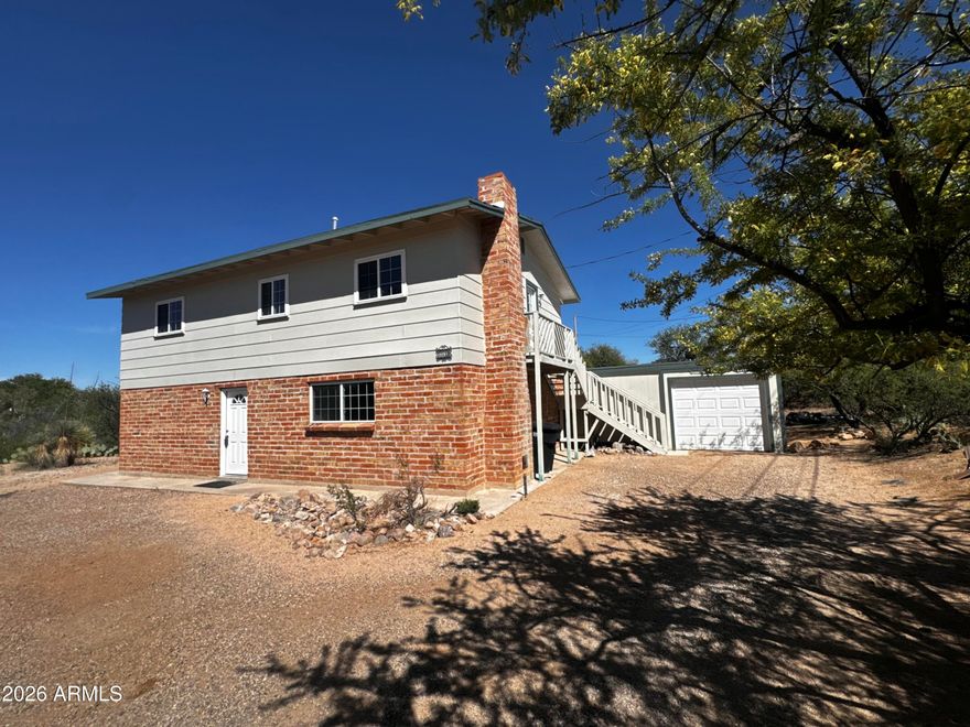 Beautifully remodeled 3-bedroom, 2.5-bath home on a spacious lot with stunning city and San Pedro River views. Features include a 1-car garage with an oversized workshop for flexible use.

The two-story layout offers a large living room, dining area, half bath, and a cozy family room with fireplace on the main level. Brick accent walls and a natural wood ceiling add warmth and character. Upstairs includes all bedrooms and full bathrooms for added privacy.

Updated kitchen and bathrooms make this home truly move-in ready.