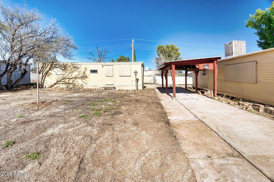 Two 1 Bed 1 Bath manufactured homes on one lot in the City of Sierra Vista. Homes need work but has newer main sewer line installed.  All utilities are available.  Owner May Carry. Sold AS IS.