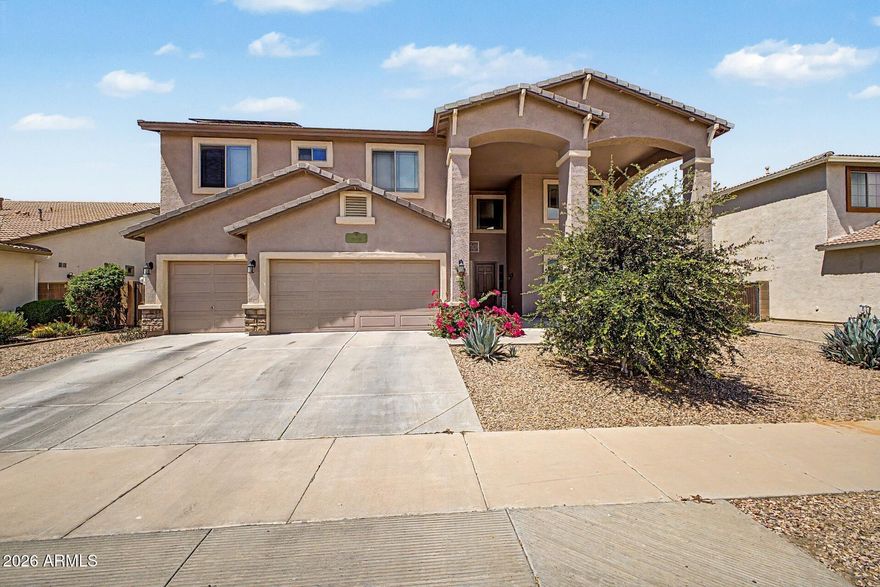 2.25% ASSUMABLE VA LOAN AVAILABLE! Spacious home on an oversized lot with a 3 car garage, RV gate, private pool with removable safety fence, and a flexible floor plan featuring 2 bedrooms and a full bathroom downstairs. The primary suite includes 2 walk in closets, dual sinks, separate tub and shower, and a covered balcony.

The kitchen features a gas stove, center island, and ample cabinet space. Additional highlights include soaring ceilings, a fireplace, upgraded lighting and fixtures, and a huge loft. Outside, enjoy a covered patio, grass area, pavers, and a sparkling pool.

Conveniently located near Loop 303, Costco, Prasada, shopping, dining, and entertainment.