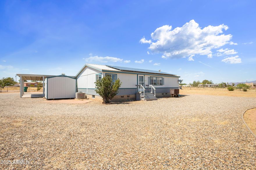 Welcome to 9611 Faith Ave in beautiful Hereford, Arizona! This charming home offers comfort, efficiency, and peaceful living with stunning mountain views. Featuring a spacious layout and a well-maintained interior, the property includes a fully owned propane tank and **solar panels that will be paid off at closing**, providing long-term energy savings and value. Enjoy the freedom of country living with no HOA, all while being just a short drive to town amenities. Don't miss the opportunity to own this energy-efficient home in a serene and scenic setting!