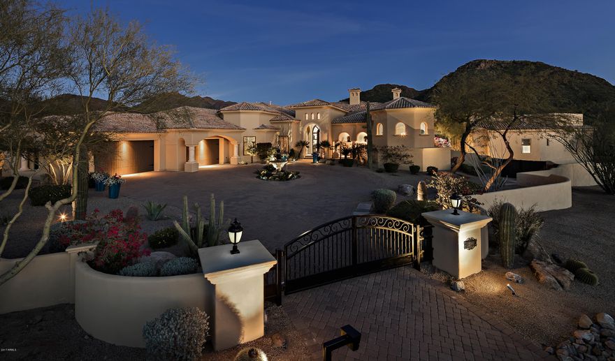 Welcome to your privately gated retreat tucked away in prestigious North Scottsdale perfectly positioned on 1.6 acres boasting 360 deg mountain & city views & resort style backyard. $1m+ spent in updates & upgrades make this home one of a kind. Desirable, spacious floor plan, split bedroom set up provides privacy & functionality. 5 spacious bedrooms, 2 his/her office options, guest wing w/ 3 oversized en-suite bedrooms & sitting/TV area. Amazing entertaining options in detached 2000sf guest house overlooking sparkling pool & spa. A true entertainers paradise w/full guest suite, professional theater, full bar & soaring ceilings. Access the large view deck for sunset cocktails & billion dollar city & mountain views. Backyard features multiple options-recreation dining, relaxing & star gazing