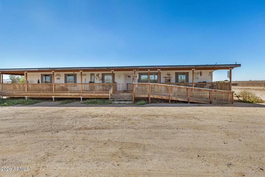 1.08-acre property • Single-level 4 bed / 3 bath • No HOA area and owned solar. 
Manufactured home on 1.08 acres in Wittmann with 4 bedrooms, 3 bathrooms, and 2,017 sq ft. Single-level layout with open living area, spacious kitchen, and split-bedroom design. Primary suite includes private bath. Large lot offers space for RV parking, additional structures, or outdoor use. Desert setting with mountain and open sky views. Located near US-60/Grand Ave for access to Surprise retail, dining, and services. Approx. 20 to 25 miles to Lake Pleasant Regional Park and 10 to 15 miles to Hassayampa River Preserve. Acre property with flexible use.