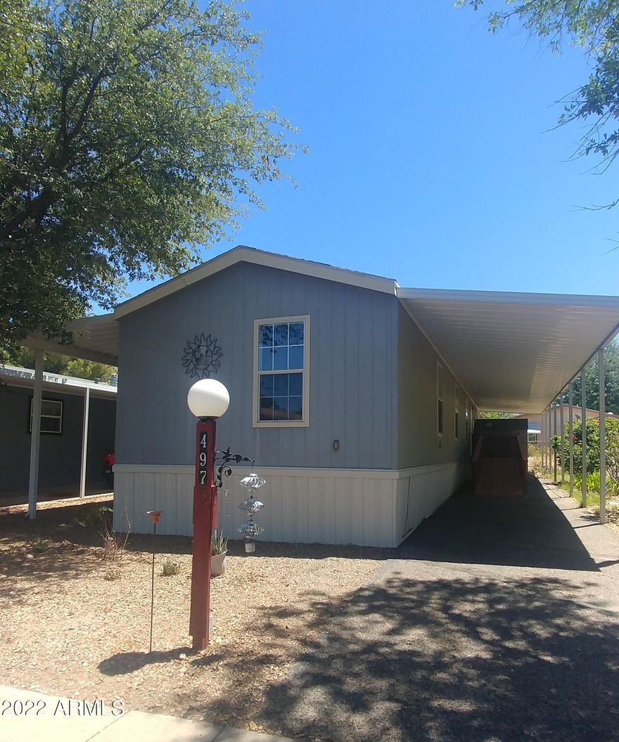 This is a nice home in a nice park! 2005 Palm Harbor. Has all dry wall and texture inside. 3 bedroom, 2  bath. Approximately 1,056 square feet. Plus  a good sized screened in porch to enjoy! Well maintained home with an open concept floorplan. 2 clubhouses, 2 pools, (one is indoor) and spa. Gated community.