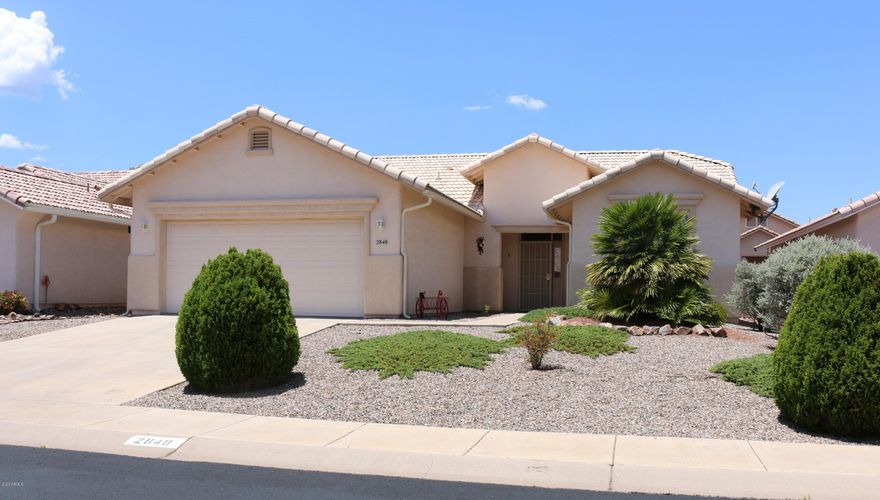 VERY NICE HOME IN THE GATED COMMUNITY OF WINTERHAVEN!  This ACTIVE ADULT (55+) Community offers many amenities for LEISURE LIVING.. Has 2 Clubhouses, Pools, Spa, Shuffle Board, Gym, Fitness Classes, BBQ area & lot's of activities. This 2 Bedroom, 2 Bath home is Light & Bright with a spacious floor plan. Tile & Carpet in all the right places. Open kitchen with lots of cabinets and granite countertop. Fireplace adds charm to the Great Room. Oversized Master Bedroom with large bathroom & 2 closets. 2 Car garage with mud sink.  Low maintenance front & back yard. READY TO MOVE IN!
