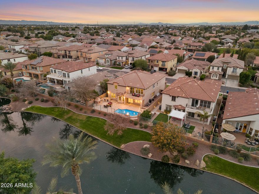 **Seller is offering $10k towards rate buy-down! Wake up to shimmering lake views and resort-style luxury every day. This updated 6-bed, 4-bath lakefront residence delivers refined living with a grand two-story entrance, chandelier, cantera front door, freshly repainted interiors throughout and 3 Brand New HVAC units just installed! The reimagined kitchen shines with newly upgraded cabinets and quartz counters, complemented by newer appliances. All bathrooms have been recently redone with high-end quartz, vessel sinks, and spa-inspired walk-in showers. Entertain with ease in the family room with built-ins and gas fireplace, formal dining with tray ceiling, a massive loft, and a bonus media room with stage flooring. The primary suite is a true retreat, featuring a private lake-view balcony, gas fireplace, dual closets, and a stunning spa bath with dual vanities, makeup vanity, soaking tub, and multi-head marble shower. Step outside to a resort-style backyard boasting premium lakefront views, polished travertine covered patio, LED lighting, a pool with fire and water features, built-in BBQ, rose bushes, and a cozy outdoor gas fireplace. Additional highlights include a brand-new water heater, 3 brand-new AC units, surround sound, Nest thermostats, security system, and a 3-car garage with epoxy floors, EV charger, water softener, and recirculation pump - luxury living at its finest.