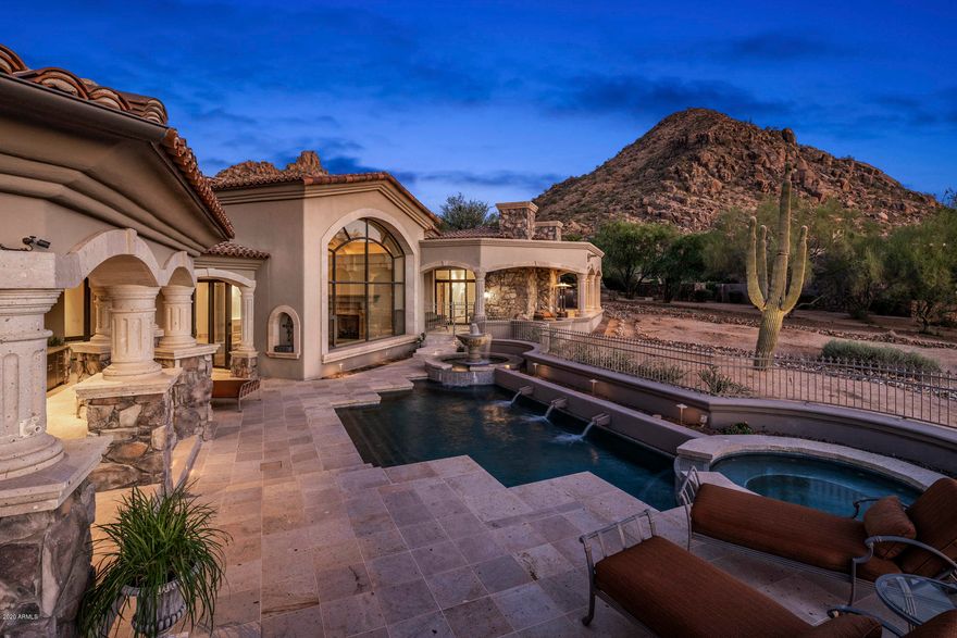An exquisite estate located on a quiet cul-de-sac overlooking the 5th fairway of Estancia, a private golf club with 24/7 guarded gates. Potential multigenerational living designed for privacy. Premium view lot also offers unparalleled sunsets, moonsets, city lights, & mountain views. Custom built & thoughtfully designed with w/ extensive use of hand crafted wood & natural stones. Abundant storage. Chef's kitchen with large center island & butler's pantry...flowing seamlessly to the main gathering area of the home. Family room with a custom carved/handcrafted bar having spectacular views. Large covered patios w/ heated pool/spa, & an outdoor kitchen, excellent for entertaining. Over 8,000 sq. ft., this meticulously maintained home exudes true pride of ownership.
