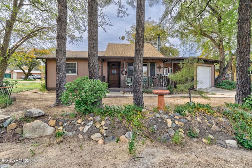 Where the desert breeze meets the mountain air.' Enjoy clean air, blue skies, and the natural beauty of Yarnell from this tastefully restored ranch rambler; set among towering pines. This property includes a 2-bed, 1-bath in the MAIN home PLUS a separate 1-bed, 1-bath CASITA, currently rented and offering excellent short or long-term income potential. Interior updates feature new engineered hardwood floors, a remodeled kitchen and great room, and a new wood-burning fireplace surround.  Whether you're seeking a full-time residence, a weekend escape, or an investment opportunity with built-in rental income, this Yarnell charmer delivers.  With no HOA, nearby schools, and Yarnell's historic downtown, antique shops, trails, and the Shrine just minutes away, this home offers a rare blend of his With no HOA, nearby schools, and Yarnell's historic downtown, antique shops, trails, and the Shrine just minutes away, this home offers a rare blend of history, comfort, and lifestyle appeal with the perfect blend of charm, convenience, and mountain-town living.