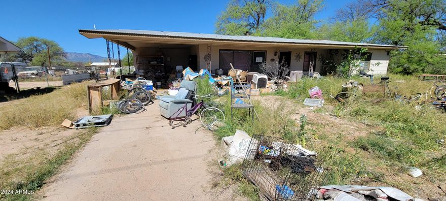 Tons of potential! Yes, this home needs TLC, but just look at the price! The main house has 3 bedrooms and 1 bath and the guest apt or inlaws suite is 1 bedroom 1 bath. The dining is located off of the kitchen and has an open floor plan. There is storage in the back as well. This is a totally AS IS sale and cash offers only. There is a Hold harmless form that all potential customers must sign prior to accessing the property.