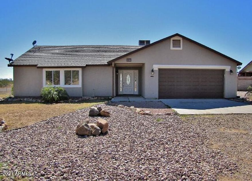 This well maintained, 3BR/2BA/2CG, 1519 sq. ft. home on a half acre is located in Huachuca City, AZ minutes from Ft. Huachuca and Sierra Vista, AZ. The open floor plan has a large living area, new wood laminate floors, central A/C and a huge back yard. Landscape maintenance, exterior pest control and garbage/sanitation are included.  Call today.