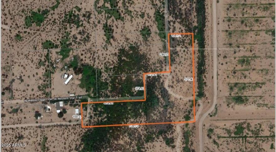 Heavily vegetated level property - irregular shape with 4++ acres - legal access from Western Star - perfect place for a secluded home.  Utilities at physical end of Western Star