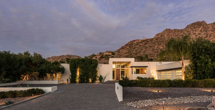 This sleek contemporary showpiece, renovated in 2019, has clean lines, modern architecture, fresh finishes and impeccable taste. The setting is so exquisite you'll dream of making a move from the moment you see it. Room after room showcases mid-century modern perfection and superior quality, creating a soft elegance that is absolutely breathtaking. Whether dining al fresco, sipping an after dinner drink by the pool, soaking in the tub in the impeccable master hideaway, or entertaining in the lavish kitchen, this sophisticated residence is meant to be lived in and appreciated from every vantage point. If you're an art collector or a family with great taste, this is a home you will cherish. Perfectly set amongst outstanding mountain views in a private gated community, you can't ask for much