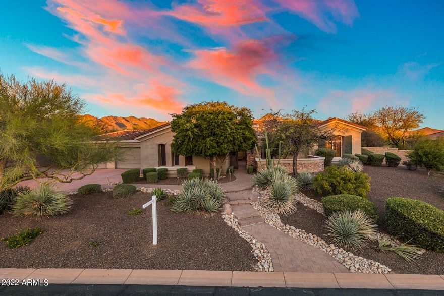 Refreshed & breathtaking! Entertainer's delight! Enter through private courtyard w raised herb bed & lime tree. Enter to soaring ceilings throughout on this King & Queen build! Montery homes construction sitting on one of the best lots behind the private gates of beautiful La Strada!. Backs to natural wash & breathtaking McDowell mountain views. 6,000 sq ft of high-end luxury in the best Scottsdale location! Owned solar, heated pool, game room, wet bar, wine cooler, office, theater room & open floor plan are just dynamite! All en-suite beds w walk in closets are split from Master retreat. Enjoy the year with weather perfectly suited for indoor/outdoor living with side & back patios that allow for seamless transitions.Patio misters & fire pit area across a statement-piece bridge in backyard