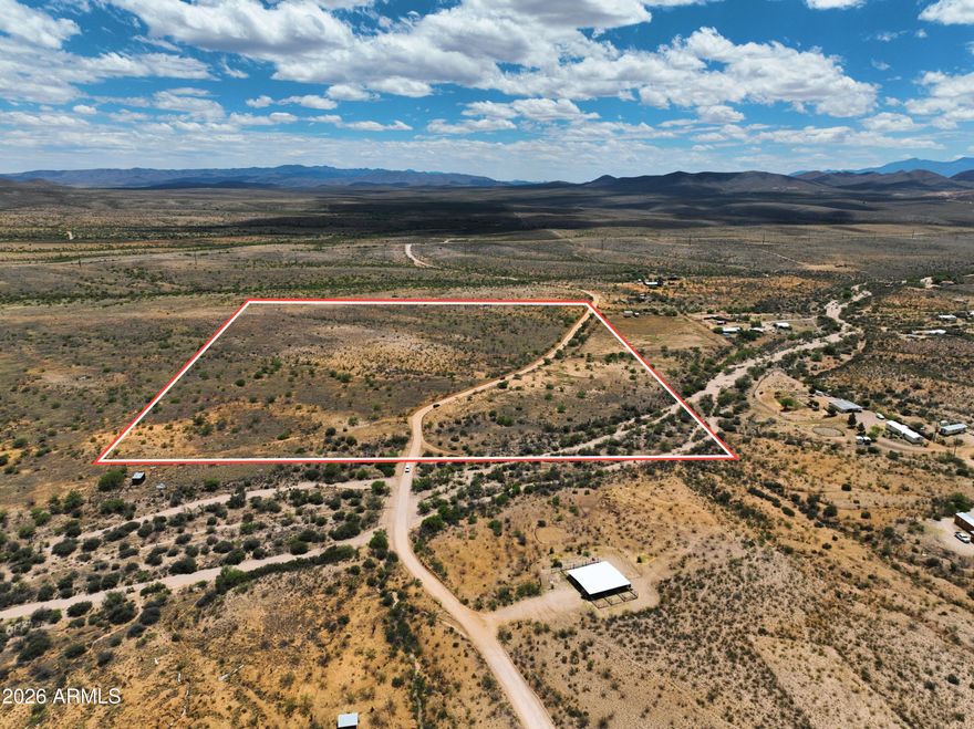 This 30+ acre parcel in Cochise County offers flat, usable terrain with mountain views and approximately 4,500 ft elevation, providing a straightforward setup for future development. Electric and water are nearby, reducing initial infrastructure planning. Zoned RU-4, the property allows for single-family homes and mobile homes, with potential for a lot split subject to county requirements. Seller may be willing to split the lot. Located just minutes from Tombstone, approximately 35 minutes to Sierra Vista, and about an hour to Tucson, the property combines rural space with access to nearby services. The open landscape and wide frontage provide flexibility for building or holding as a long-term investment. If you are looking for large acreage in Southern AZ this one is great!