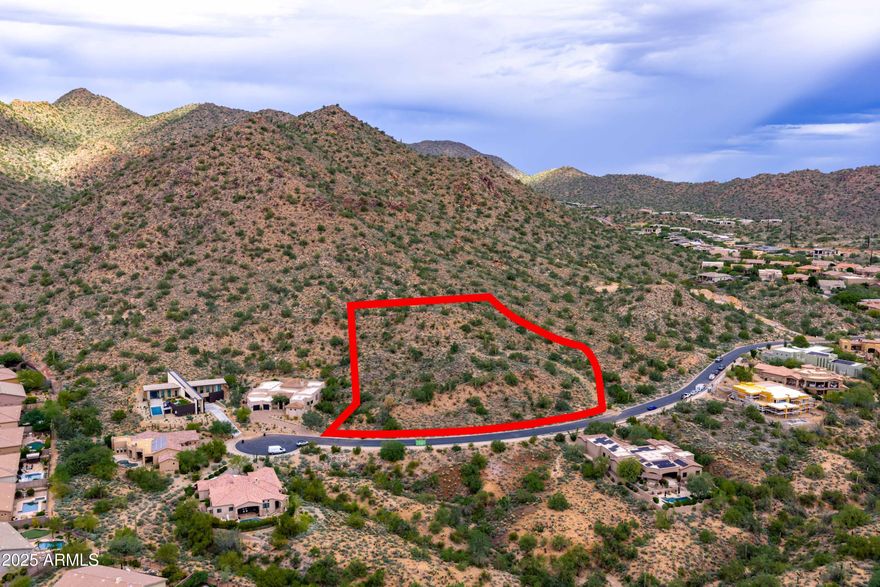 Rare opportunity to own 2.28 acres of pristine mountainside land in the gated community of Hidden Hills! This custom home lot offers exceptional privacy, peace and natural beauty while backing directly to the McDowell Mountain Preserve. Enjoy sweeping desert and mountain views with direct access to hiking and biking trails,  including the popular Sunrise Trailhead. Located behind double gates, this premium homesite provides the ideal setting to build your custom dream home. Conveniently close to the Mayo Clinic, Shea Corridor, and world-class Scottsdale amenities, experience the perfect balance of serenity and accessibility in one of Scottsdale's most desirable locations.