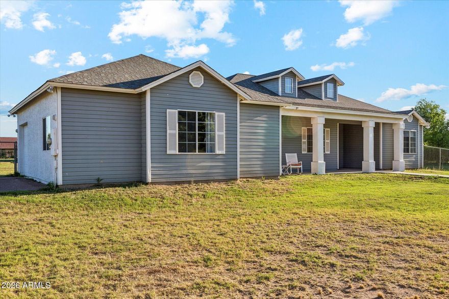 The perfect blend of country charm and city living! This gorgeous home is located on just over an acre of flood irrigated land on the county island (no HOA). The entire house has been updated top to bottom with custom cabinetry, countertops, flooring, millwork, premium lighting, and more. An open floorplan and ample storage make this house not only beautiful, but comfortable. The chef's kitchen features tons of custom cabinets and an oversized island with quartzite countertops. The large master suite includes a generously sized bedroom, spacious bathroom with double shower, and an oversized walk in closet. Outside, the spacious yard features several fruit and citrus trees, and awaits the backyard homestead of your dreams!  An EV charging outlet has been installed in the garage. Owner/agent
