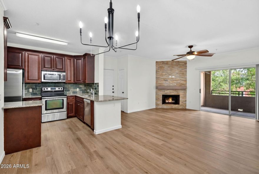 Freshly updated penthouse-level end unit in gated, resort-style Red Rox! This spacious 2BR/2BA offers the largest floor plan at 1,042 SF, abundant natural light, and large walk-in closets in both BRs. Recent updates include fresh interior paint, brand-new wood-look LVP flooring, and new BR carpet. Kitchen and baths feature granite counters and beautiful backsplash details for a clean, move-in-ready feel.  Ideally located and close to all the amentities. Red Rox amenities include 2 sparkling pools, spa, cabanas, lagoon, fountain, fitness ctr, media rm, putting green, BBQ areas, and more. Prime location moments to ASU, Sky Harbor, Papago Park, Phoenix Zoo, Desert Botanical Garden, Downtown Phoenix, Old Town Scottsdale, light rail, Tempe Town Lake, Mill Ave, and Loop 202