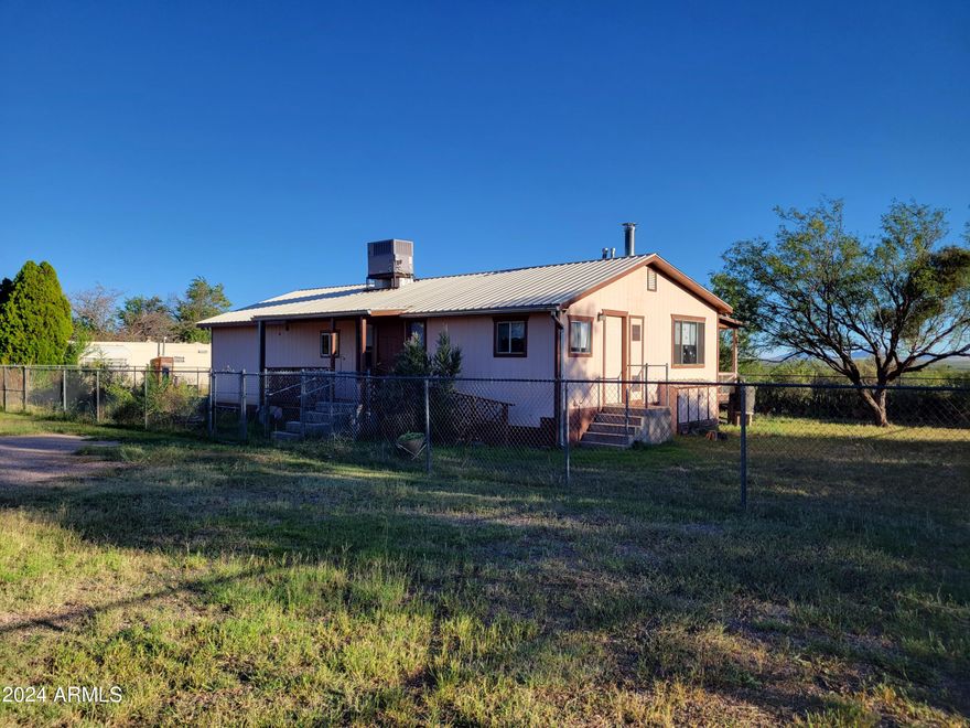 One parcel of 1.25 acres, has 4 Manufactured home sites.  Live in one and have an income with the rentals. 3 of the 4 MFH's are habitable. 2 units currently rented and one is vacant. There are 2 separate power boxes, one for the 2 Northern sites (#2418 & #2424) and one power box serves the 2 southern sites (#2428 &2432) #2428 is not connected to power or gas at this time. 3 of the sites have it's own gas meter. All units feed off the same water meter. Renters are in #2418 & #2424, each are rented for $650. Monthly includes Water and Power. Two Septic tanks , one serves north and one serves south. The property has 3 additional storage sheds and a carport. 3 of the units have independent laundry rooms, and fenced yards. #2432 is vacant an move in ready. Buyers to verify all facts and figur