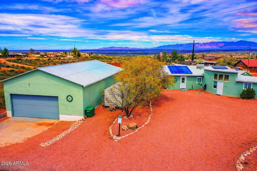Located in the highly desirable Historic Tombstone area, this unique in-town property sits on a rare 1.4-acre lot offering space, income potential, versatility, & charm. The property features a spacious 2,000 sq. ft. workshop with 10'x22' doors, ideal for automotive enthusiasts or business use. A separate accessory dwelling provides excellent income potential as an Airbnb, guest house, or multigenerational living. Average solar bill of approximately $36 a month. Also included is an RV lot with sewer hookup & a large dog run. Enjoy outdoor living year-round under the covered patio, perfect for entertaining or relaxing. With room to spread out while still being close to town amenities, this property offers endless possibilities in a truly special & unique setting. Don't miss out on this gem!