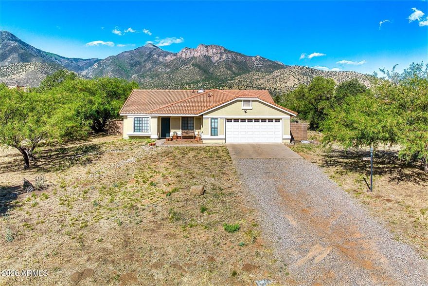 Here's a great home in Foothills Ranch that sits on nearly 2 acres of land with awesome views of the Huachuca Mountains.  The home features a formal living and dining along with a family room complete with fireplace and a breakfast nook.  You'll find 4 bedrooms with the primary being large and one room that was used as an office.  Out back you'll find a swimming pool that is great for the family to play and cool off in the summer breezes.  There's a covered patio and an added kitchen and entertaining space that you will love.  This home has just had PEX water lines installed throughout the home.  The home has so many possibilities!  You won't want to miss this great home at a very reasonable price.
