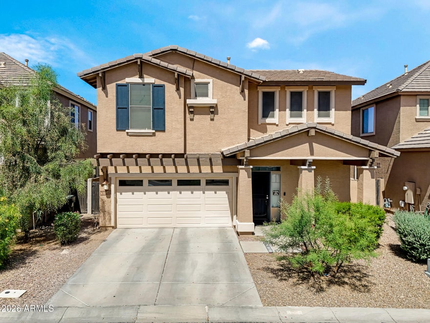 Welcome to this beautiful two-story home in the heart of Gilbert, located in the sought after Spectrum at Val Vista neighborhood! This wonderfully maintained home features 20'' diagonal porcelain tile throughout the first floor, an open living area, a fantastic kitchen with two pantries, and a laundry area. The kitchen boasts granite countertops, beautiful wood cabinets with ample storage, stainless steel appliances, a center island with a breakfast bar, a conveniently located half bath, and an eat-in dining area. The second level includes a large open loft, a built-in hallway workstation, four bedrooms, and two full bathrooms. The spacious primary bedroom features an en suite bathroom with double sinks, a separate soaker-style tub, walk-in shower, separate toilet room, a generous walk-in closet as well as a second closet in the room. Outside you'll find your private backyard area, which includes a large covered porch and low-maintenance landscaping including artificial grass. Located just minutes from the Loop 202, San Tan Village shopping, dining, entertainment, Spectrum Elementary, and so much more! Spectrum at Val Vista community offers access to many parks, playgrounds, tennis courts, and running/walking trails.   This home is just waiting for you!