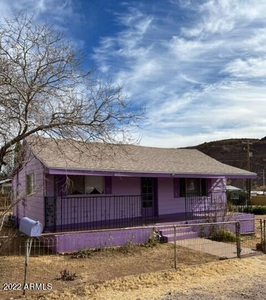 CUTE (freshly painted :-) 3bd/1bath bungalow in Bisbee! Enjoy your evening sitting on the extended front porch in this nice quiet neighborhood. Completely fenced and located on a LARGE LOT with plenty of room to park your RV. The Large Master bedroom has 2 closets with ceiling fans and there is a stand alone wood stove that can heat the whole house! Call for a private viewing today!